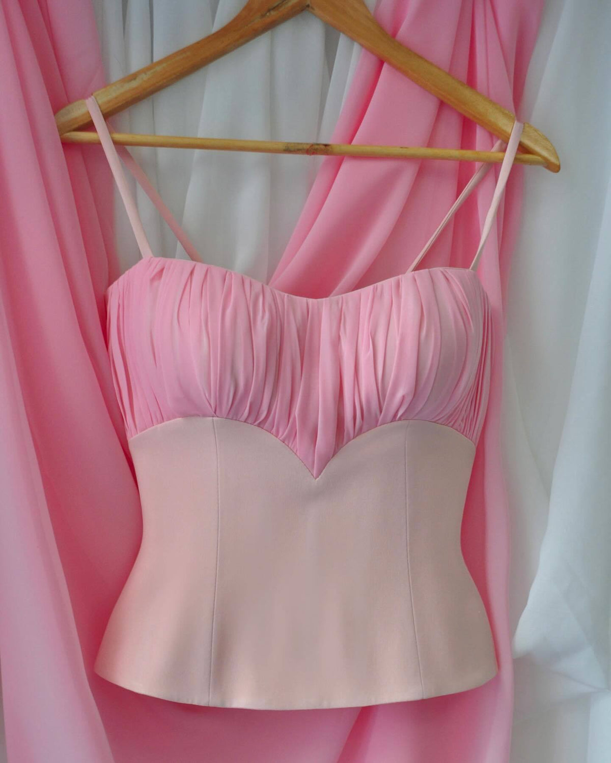 Sweet girl style pink wrap top with heart-shaped neckline, dense pleated design, vertical paneling, fishbone waist, and short back