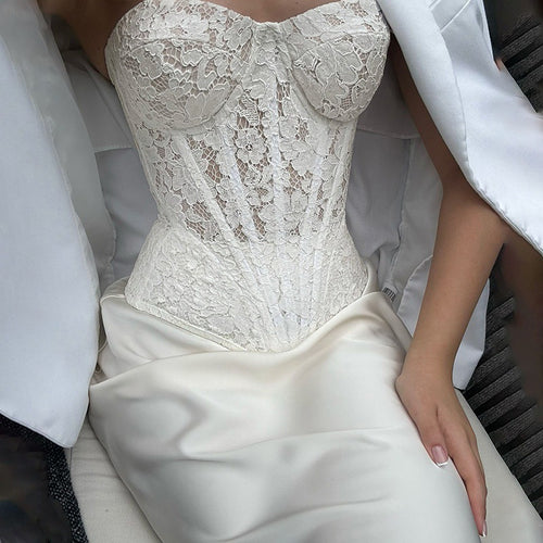 2025Spring new collection: a two-piece set featuring a sheer, elegant fishbone-patterned, asymmetrical tube top and a long, flowing skirt